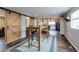 Charming dining area with rustic bar seating and barn door accent at 329 2Nd St, Frederick, CO 80530