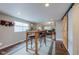 Open dining area with bar seating, with views into other living spaces at 329 2Nd St, Frederick, CO 80530