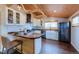 Bright kitchen features white cabinetry, butcher block counters, and modern appliances at 329 2Nd St, Frederick, CO 80530