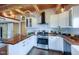Well-appointed kitchen boasts butcher block counters and stainless steel appliances at 329 2Nd St, Frederick, CO 80530