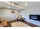 Cozy living room showcasing a fur-covered chair and modern wall fireplace at 329 2Nd St, Frederick, CO 80530