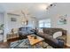 Comfortable living room featuring a bull skull decoration and plush seating at 329 2Nd St, Frederick, CO 80530