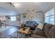Inviting living room boasts stylish decor, comfortable seating, and natural light at 329 2Nd St, Frederick, CO 80530