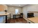 Well-lit home office featuring laminate floors, functional desks, and a comfortable executive chair at 329 2Nd St, Frederick, CO 80530
