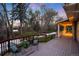 Relaxing covered deck with comfortable seating, a potted plant, and views of the tranquil, snow-dusted backyard at 1970 Garland St, Lakewood, CO 80215
