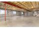 Unfinished basement with concrete floor, exposed ceiling, and multiple windows at 1970 Garland St, Lakewood, CO 80215