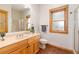 Bathroom features include wood-trimmed windows, a glass shower, and ceramic tile floors at 1970 Garland St, Lakewood, CO 80215