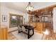 Open-concept dining room showcasing natural wood trim, hardwood flooring, and seamless integration with the kitchen at 1970 Garland St, Lakewood, CO 80215
