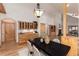 Dining area with wooden cabinetry, a fireplace, and view of living room area; great for entertaining and relaxation at 1970 Garland St, Lakewood, CO 80215