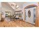 Bright foyer with hardwood floors, high ceilings, and decorative glass front door at 1970 Garland St, Lakewood, CO 80215