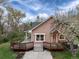 Charming single-Gathering home featuring a large front deck and landscaped front yard at 1970 Garland St, Lakewood, CO 80215