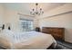 Bright bedroom with hardwood floors and plenty of natural light at 111 S Monroe St # B207, Denver, CO 80209