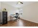 Home office with hardwood floors and built-in shelving at 2643 S Cook St, Denver, CO 80210