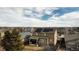 Aerial view of the house showing the backyard, houses in the neighborhood, and solar panels at 239 N Irvington St, Aurora, CO 80018
