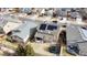 Aerial view shows solar panels on the roof, plus backyard with trampoline, patio, and fence at 239 N Irvington St, Aurora, CO 80018