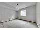 Unfinished basement offers potential for future expansion with a window allowing natural light at 239 N Irvington St, Aurora, CO 80018