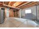 Spacious unfinished basement with exposed utilities, insulation, and a window at 239 N Irvington St, Aurora, CO 80018