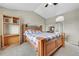 Comfortable bedroom with wood bed frame, storage shelf, ensuite bathroom featuring tiled shower at 239 N Irvington St, Aurora, CO 80018