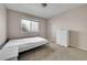 Bedroom features neutral walls, carpeted floor, and a window bringing in natural light at 239 N Irvington St, Aurora, CO 80018