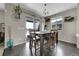 Cozy dining area with a wooden table, seating for six, and sliding glass door to the deck at 239 N Irvington St, Aurora, CO 80018