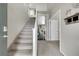 Bright entryway featuring stairs, neutral tones, and an open layout to the main living areas at 239 N Irvington St, Aurora, CO 80018