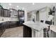 Bright kitchen showcasing dark wood cabinets, granite countertops, and a farmhouse sink at 239 N Irvington St, Aurora, CO 80018