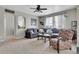 Comfortable living room featuring plush seating, neutral decor, and an abundance of natural light at 239 N Irvington St, Aurora, CO 80018