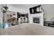 Living room showcasing a fireplace, adjacent to dining area with seamless flow to modern kitchen at 239 N Irvington St, Aurora, CO 80018