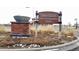 Community sign reading 'Traditions Pool & Recreation Center' for neighborhood amenities at 239 N Irvington St, Aurora, CO 80018
