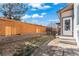 Backyard featuring a retaining wall and a wooden fence at 21893 E Layton Dr, Aurora, CO 80015