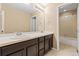 Bright bathroom with double vanity and a shower-tub combo at 21893 E Layton Dr, Aurora, CO 80015