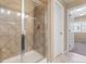 Bathroom featuring a tile shower with glass door and bright lighting at 21893 E Layton Dr, Aurora, CO 80015