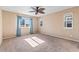 Bedroom featuring three windows, neutral walls, and a ceiling fan at 21893 E Layton Dr, Aurora, CO 80015