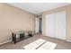 Bedroom featuring neutral carpet, bright lighting, and a closet at 21893 E Layton Dr, Aurora, CO 80015