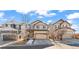 Charming two-story home with a two car garage and nicely landscaped front yard at 21893 E Layton Dr, Aurora, CO 80015