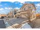 Attractive two-story home with a large driveway and rocks around the yard at 21893 E Layton Dr, Aurora, CO 80015