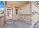 Nice front porch with stone trim and a covered entry at 21893 E Layton Dr, Aurora, CO 80015