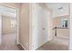 Hallway with neutral carpet and a closet with a door at 21893 E Layton Dr, Aurora, CO 80015