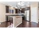 Updated kitchen boasts stainless steel appliances, granite countertops, and a functional center island for food preparation at 21893 E Layton Dr, Aurora, CO 80015