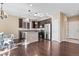 Spacious kitchen with a large island, stainless steel appliances, wood floors, and ample cabinet space at 21893 E Layton Dr, Aurora, CO 80015