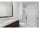 Bathroom features granite countertop, glass shower door, and white subway tile at 188 S Locust St, Denver, CO 80224