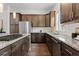 Well-equipped kitchen featuring an island cooktop and granite countertops at 188 S Locust St, Denver, CO 80224