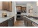 Gourmet kitchen with stainless appliances and elegant granite countertops at 188 S Locust St, Denver, CO 80224