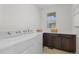 Functional laundry room with modern appliances and built-in countertop space at 188 S Locust St, Denver, CO 80224