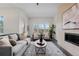 Bright living room with fireplace, stylish rug, and comfortable seating at 188 S Locust St, Denver, CO 80224