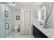 Modern bathroom with a walk-in glass shower, neutral walls, and illuminated mirrors at 7192 S Vine E Cir, Centennial, CO 80122