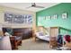 Cozy bedroom with neutral walls, carpet, ceiling fan, and a large window for ample natural light at 7192 S Vine E Cir, Centennial, CO 80122