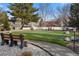 Community green space with putting green, walking path, and seating at 7192 S Vine E Cir, Centennial, CO 80122