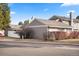 Exterior view of the home with well-maintained siding and manicured landscaping at 7192 S Vine E Cir, Centennial, CO 80122