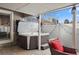 Inviting covered patio featuring a relaxing hot tub and comfortable outdoor seating at 7192 S Vine E Cir, Centennial, CO 80122